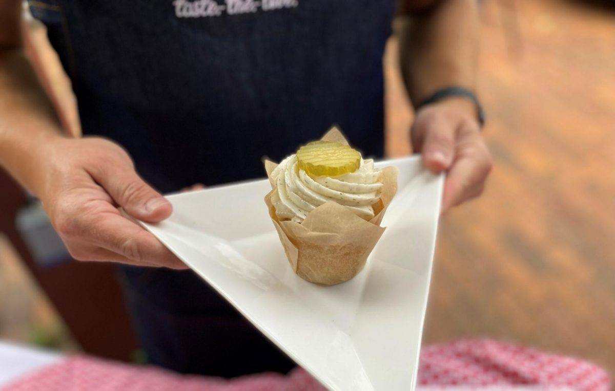 The cupcake features a savory but sweet combination starting with a moist vanilla cupcake, topped with a tangy pickle buttercream frosting and a crunchy pickle garnish. For more information visit www.luannsbakery.com.