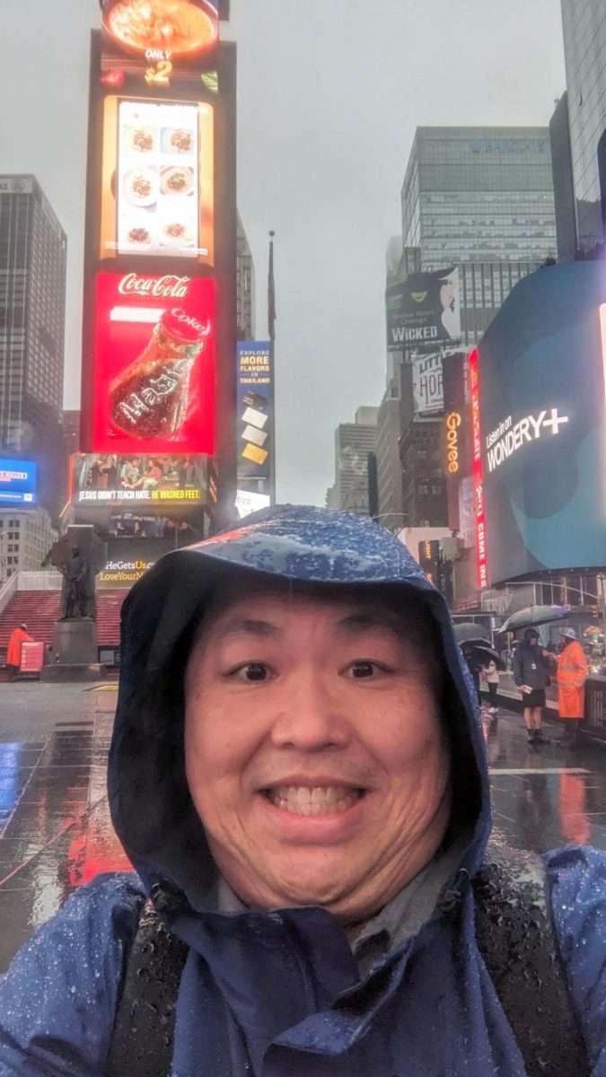 Prof. Albert Kim braved the torrential rain to take a selfie in Times Square. 
