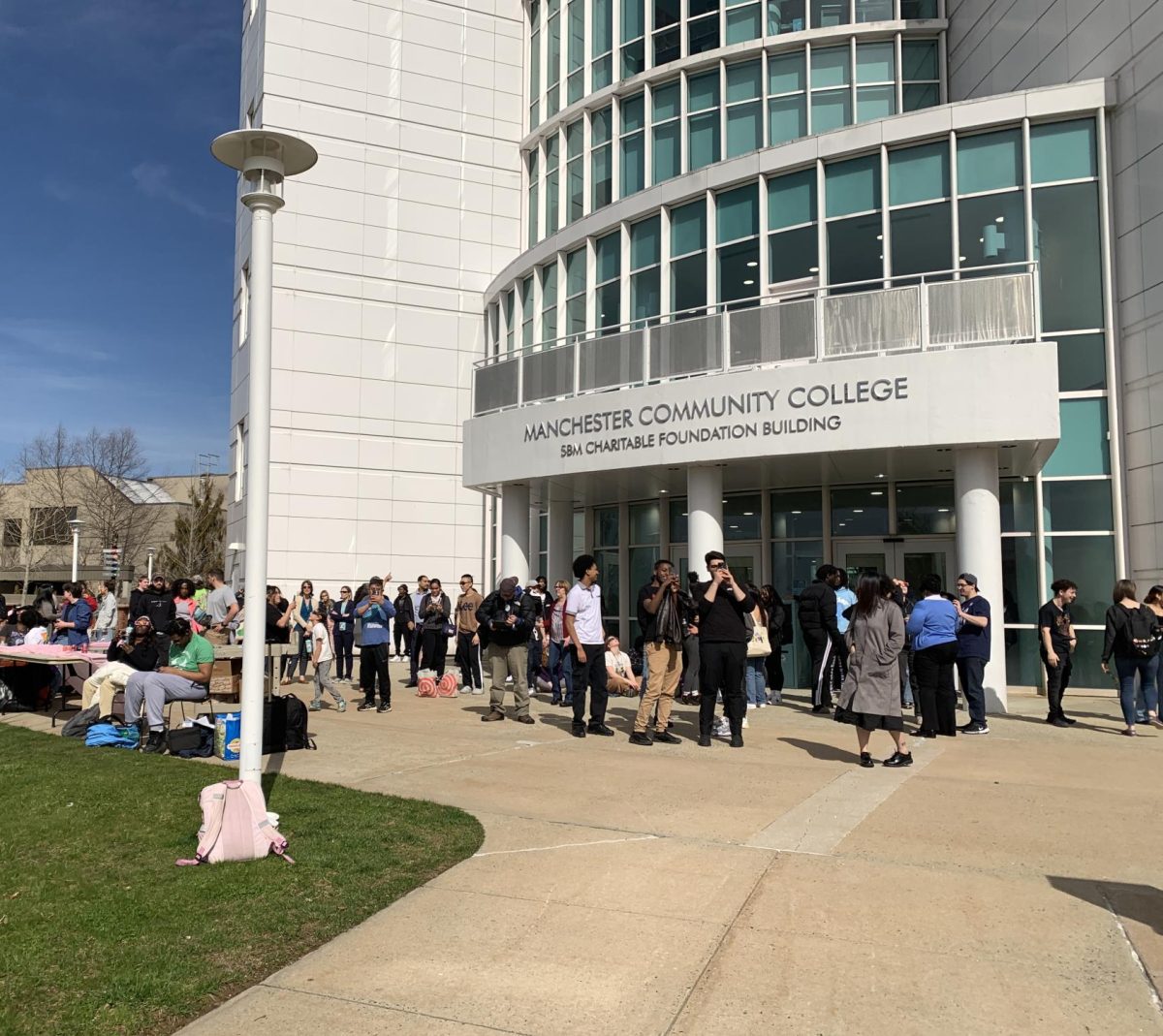 CT State Manchester Campus students, faculty, and staff come together outside the AST Tower to view the solar eclipse on April, 8th, 2024.