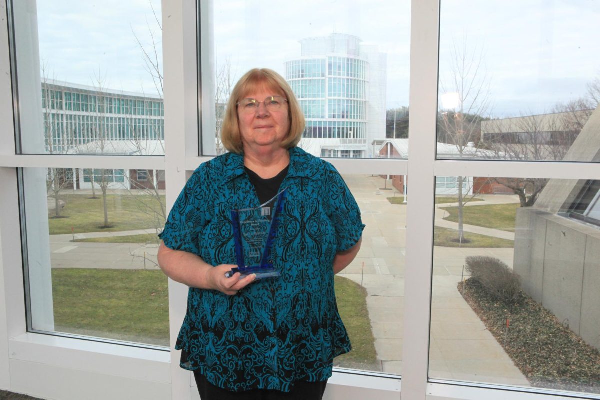 Susan Morison came to CT State Manchester in 2014. Here she is holding an award for Excellence in Teaching from the college presented to her in January 2024.