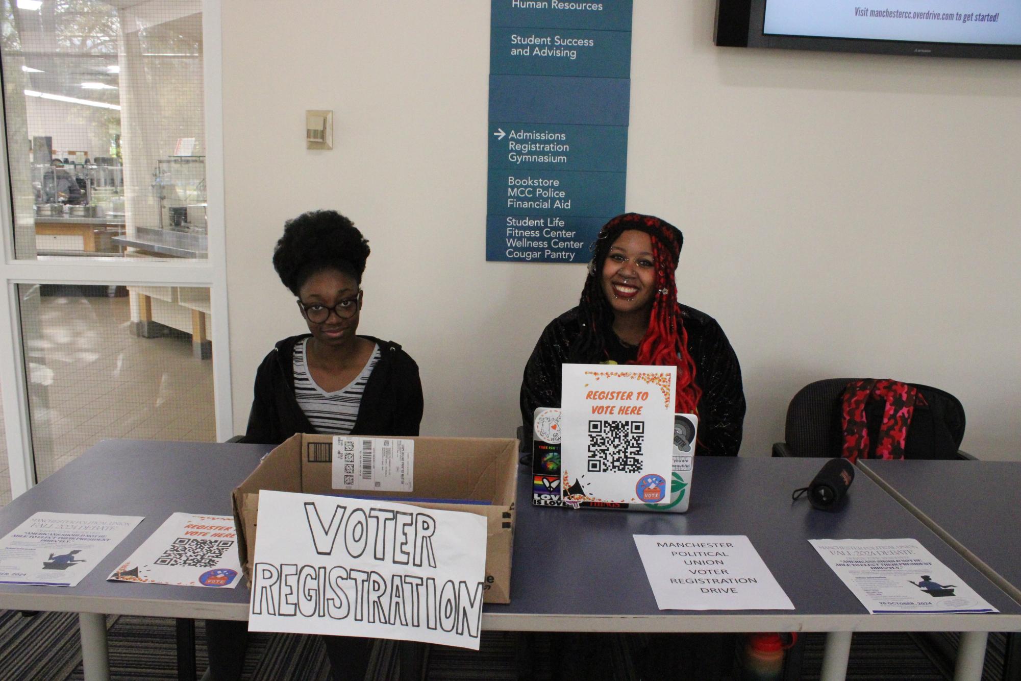 Members of the Manchester Political Union, including, left Giselle Ntiamoah-Larbi and, Kynnyah Johnson, right, held two Voter Registration drives on campus in October.