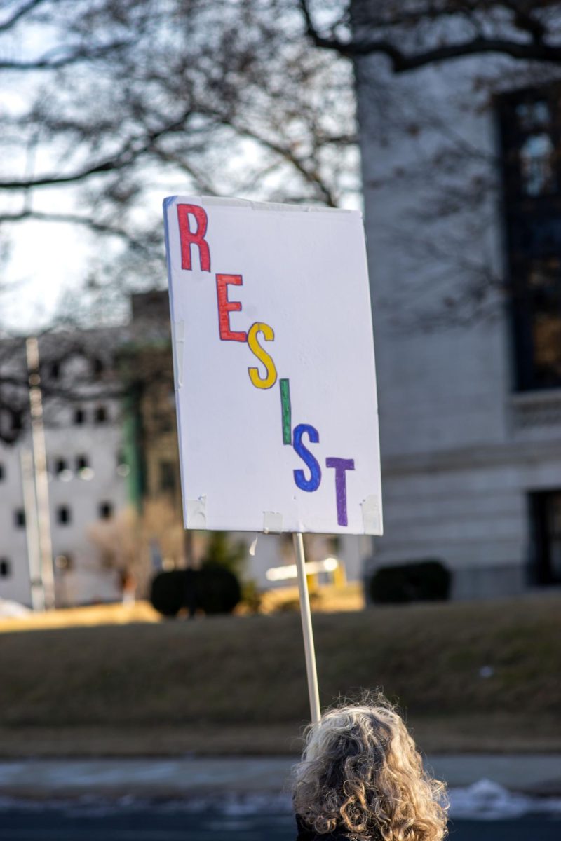 A protestor's sign shows the overall message of the 50501 protests.