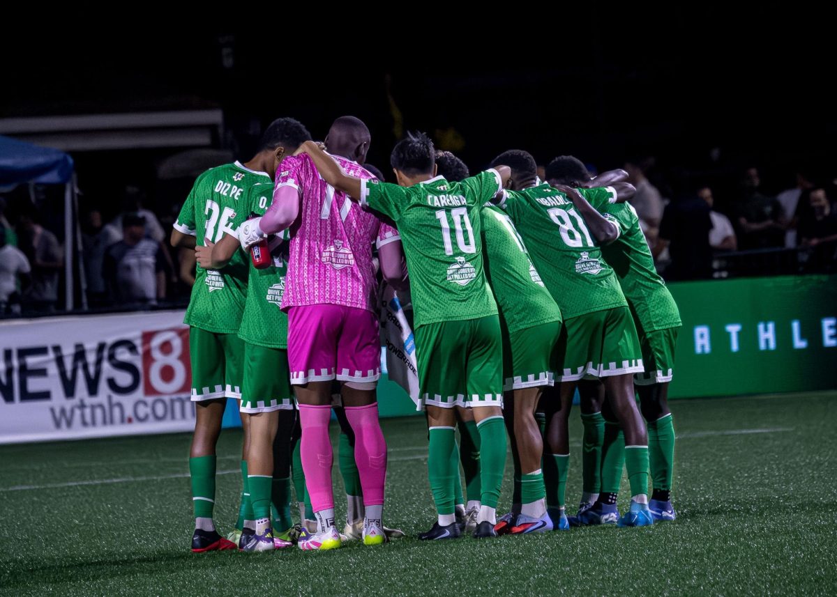 The team huddles to strategize during the second half of its winning match against Rhode Island FC Aug. 23.
