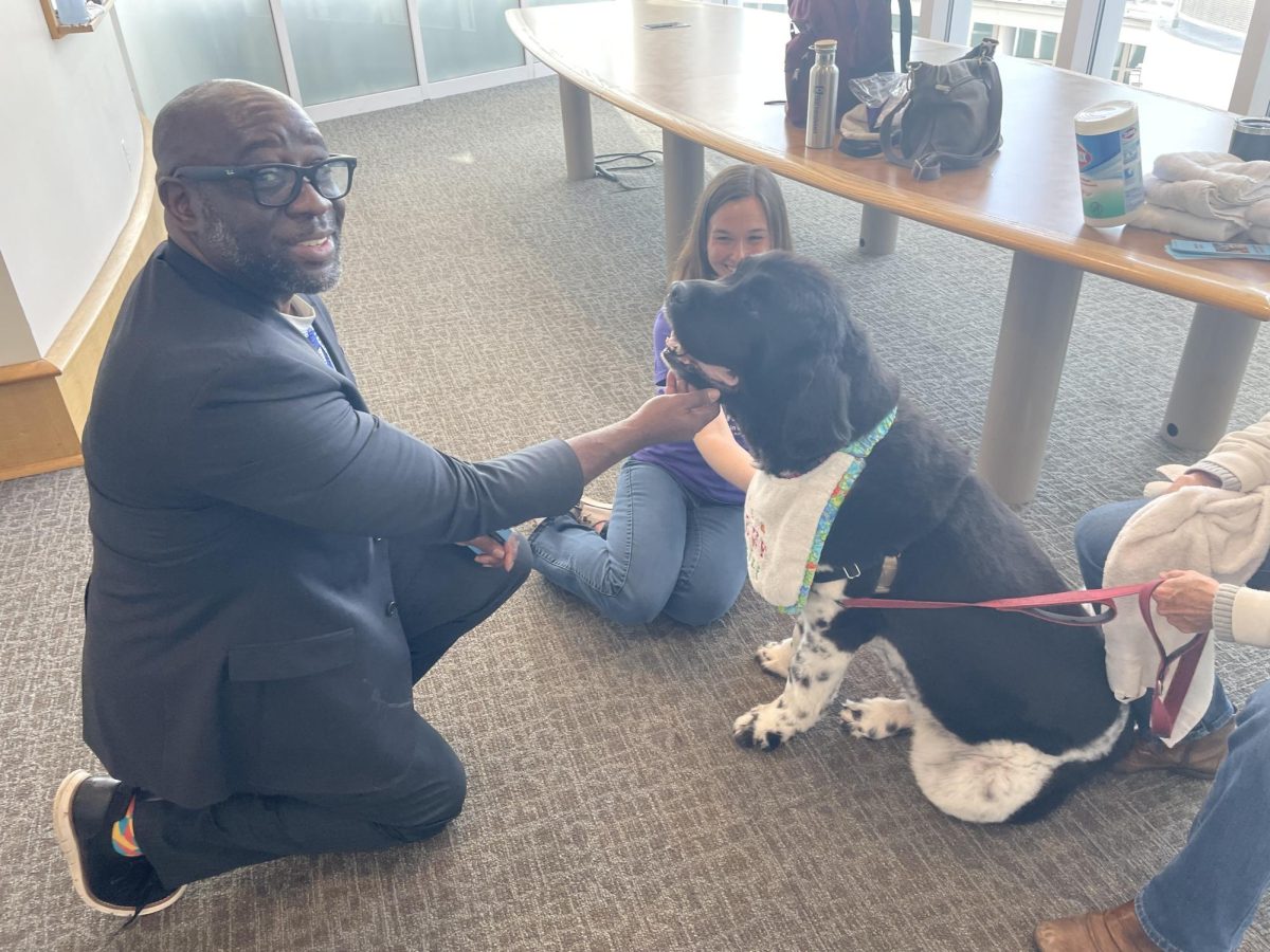 There were also dogs to pet! Dean of Student Affairs Dalexh Hunt and Sage Hojda, who teaches Therapeutic Recreation, got to know one of the therapy dogs who stopped by.