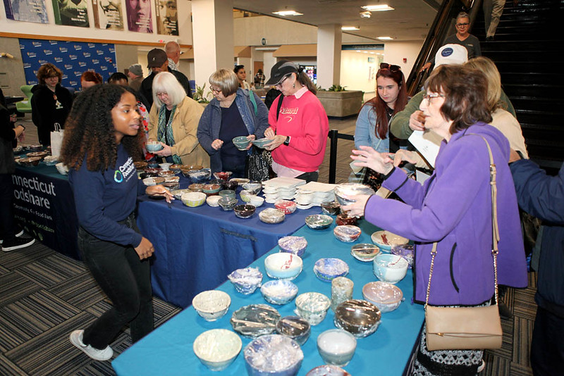 So many bowls, hard to choose just one! Attendees at the Empty Bowls event in Oct. 2024 select carefully before heading to the soup and bread line.
