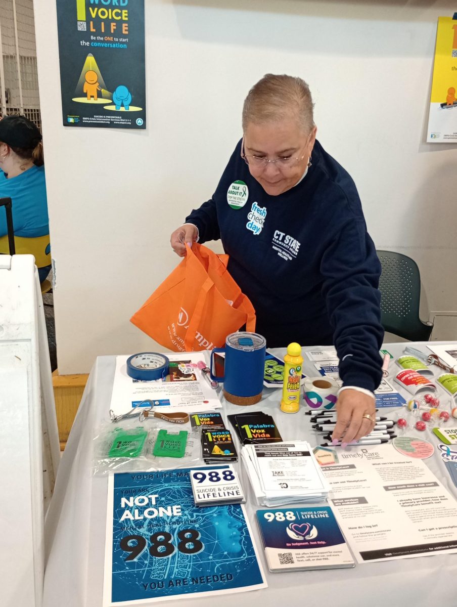 Wanda Reyes-Dawes, a counselor at CT State Manchester, manned a table that provided information on where to find help with depression and suicidal thoughts.