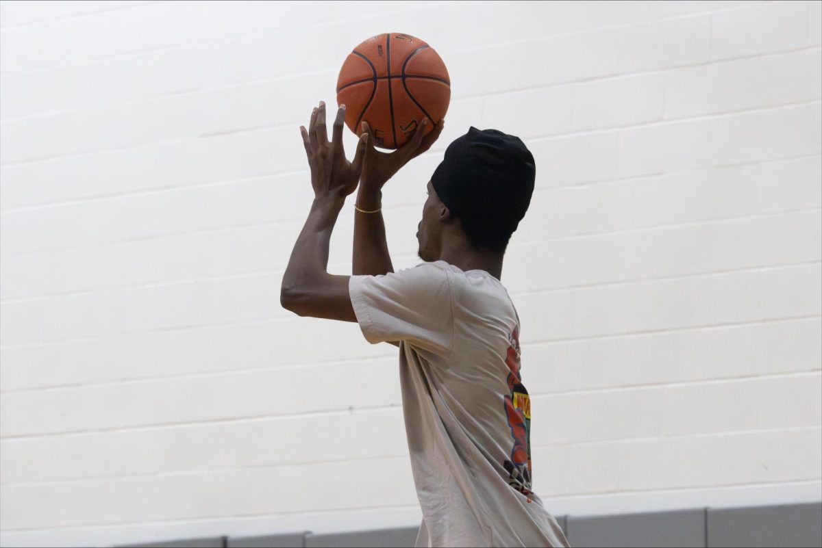 A Basketball Club member shoots his shot during a weekly meeting/game.