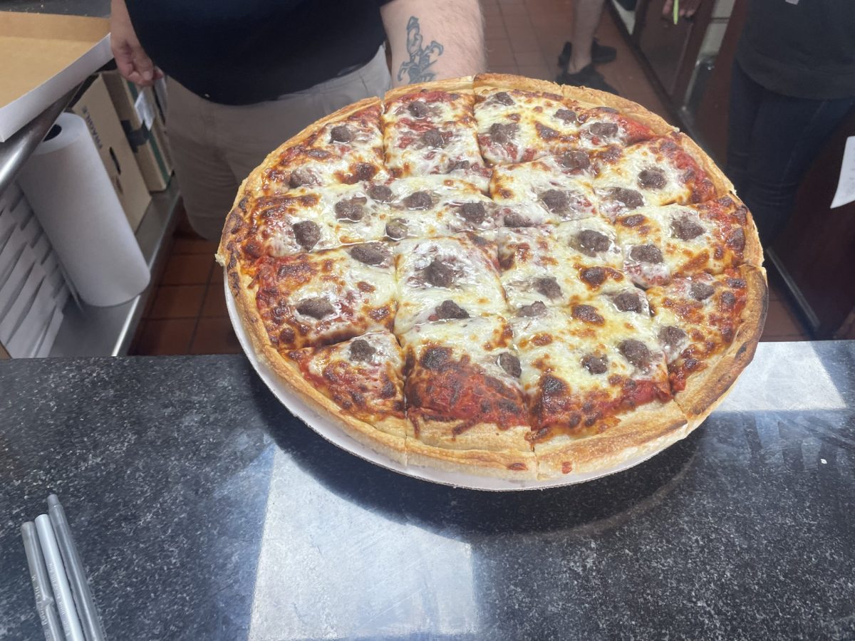 CJs Pizza specializes in a thick crust pizza, like the sausage pizza, above.